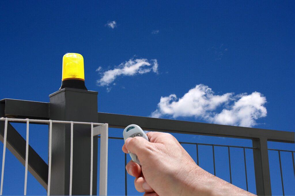 hand with remote control, automatic gate, gate opening-1926048.jpg